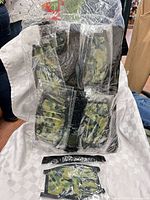 Large clear bag filled with individually wrapped camouflage masks