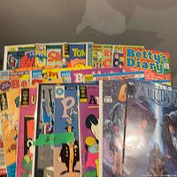 Stack of assorted comics showing titles and condition