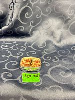 Closed pill box front view on fabric