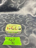 Closed pill box showing Jetsons graphic on lid