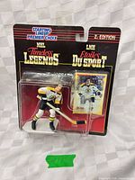 Front view of sealed Timeless Legends Phil Esposito figure and card