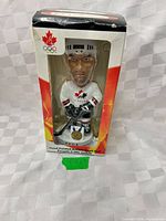 Front view of boxed Peca Team Canada Olympic bobblehead