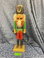 Front view of wooden nutcracker on wood base