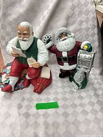 Both Santa figurines side by side