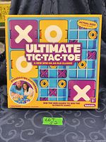 Front of sealed Ultimate Tic Tac Toe board game box