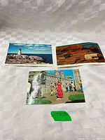 Three postcards laid out