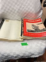 Both albums side by side; Traveler Album cover visible, binder pages visible