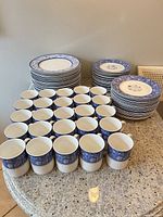 overview showing stacks of plates and rows of mugs