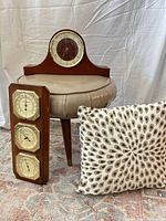 Overall lot showing mantel clock, weather panel, ottoman, pillow
