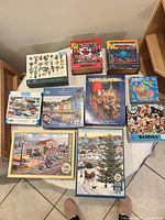 All ten boxed puzzles laid out on floor