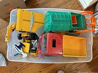 Top-down view of tub showing mixed construction toys and parts