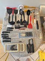 Overall view of all utensils laid out on countertop