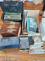 Overall lot with printer, file folders, CDs, envelopes, translator box, clock visible