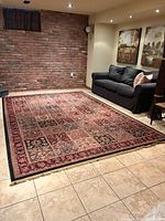 Full view of rectangular patchwork rug on tile floor