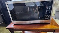 Front view of Panasonic NN-ST67KS microwave on table