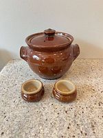 bean pot with lid and two ramelets front view