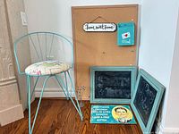 Overall lot showing chair, cork board, chalkboards, sign, mail holder, photo holder