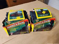 Two boxed packs of hammer-in edging showing front graphics and quantity