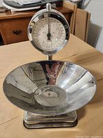 Front view showing dial, bowl, and base