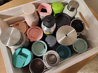 Top view of crate showing variety of bottles and mugs