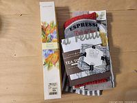 All items together including drawer liner box and stack of towels/dishcloths