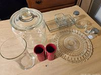 Overview of all glassware and ceramic pieces laid out on table