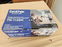 Top and front view of Brother TN-115BK box