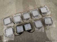 All ten LED lights in bubble wrap on floor