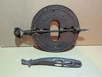 Front view of damper plate and lid lifter