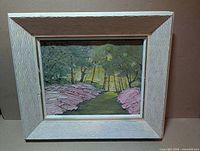 Front view of framed painting showing artwork and frame detail