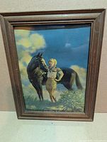 Full view of framed lithograph print in wood frame