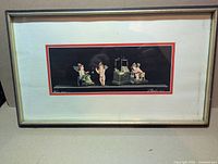 Full view of framed print showing matting and frame