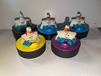 Five Mighty Ducks character puck toys front view