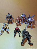Seven Gargoyles figures displayed together on tabletop