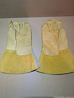 Front view of unused steerhide leather gauntlet work gloves