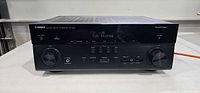 Front view of Yamaha RX-A720 receiver powered on
