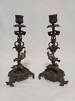 Full view of both candlesticks standing side by side