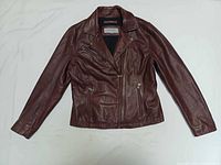 Front view of brown leather moto jacket