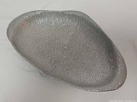 Top view showing textured surface and manta ray shape