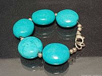 Bracelet front view showing turquoise beads and silver spacers