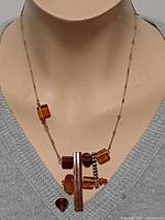 Necklace displayed on bust, front view