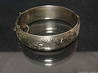 Floral engraved front of hinged sterling bangle