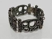 Perspective of bracelet closed showing open-work links and clasp