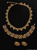 Full view of necklace, bracelet and earrings set