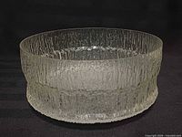 Side view showing textured cylindrical walls and clear glass