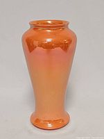 Front view of orange lustre Moorcroft vase