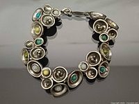 Full view of bracelet laid flat showing overall design and clasp