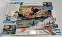Front of kit box showing contents and mountain landscape design