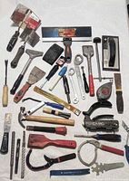 All tools laid out on white surface for overview