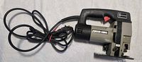 Left side view of Porter-Cable jigsaw with full cord visible